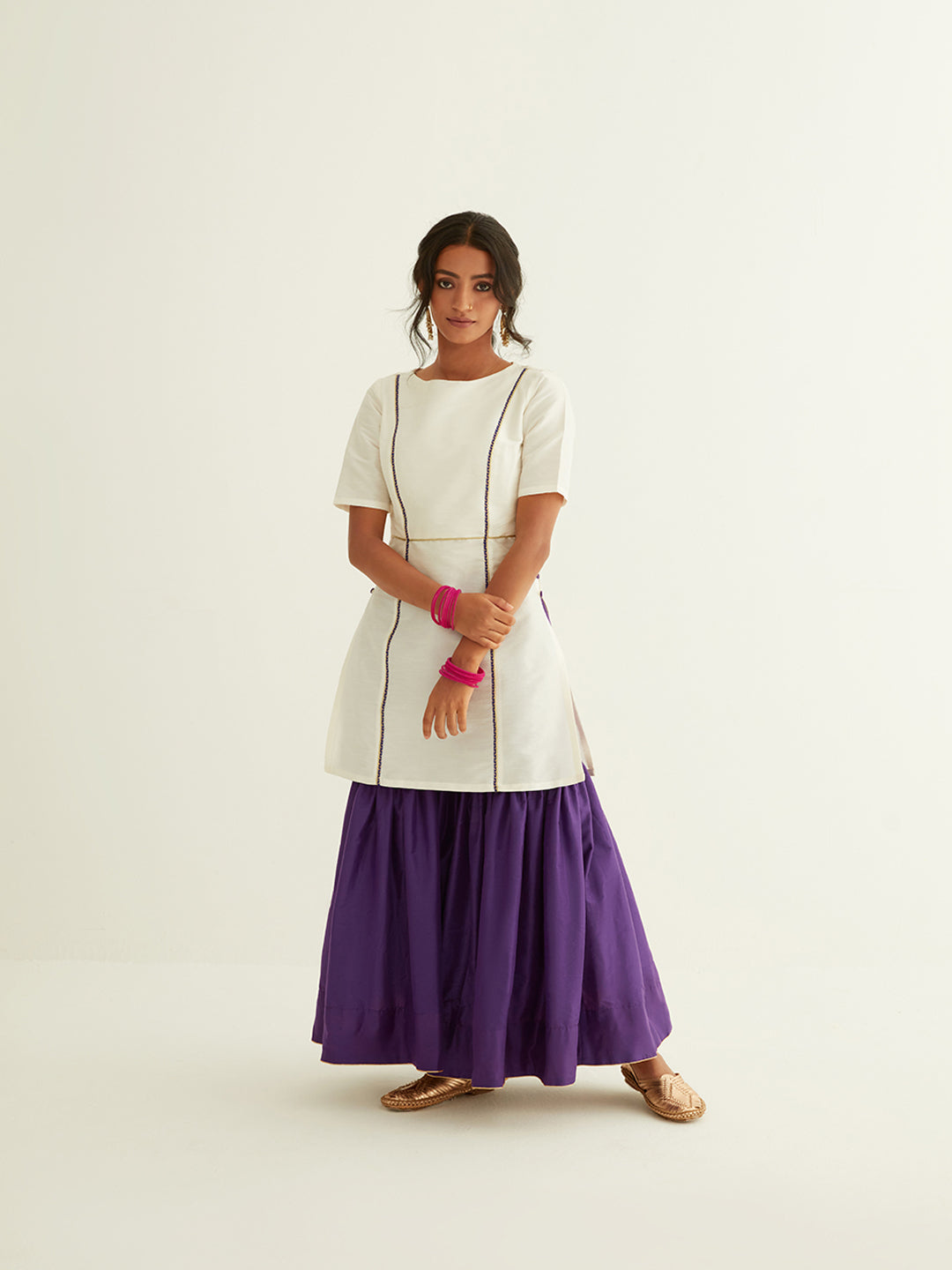 Straight short kurti with princess seam highlights paired with sharara pants