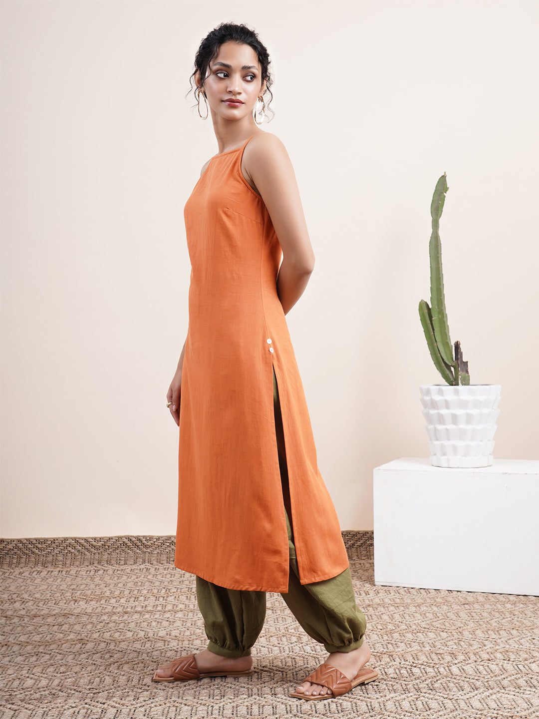 Rust Orange Spaghetti-sleeved kurta paired with pathani pants