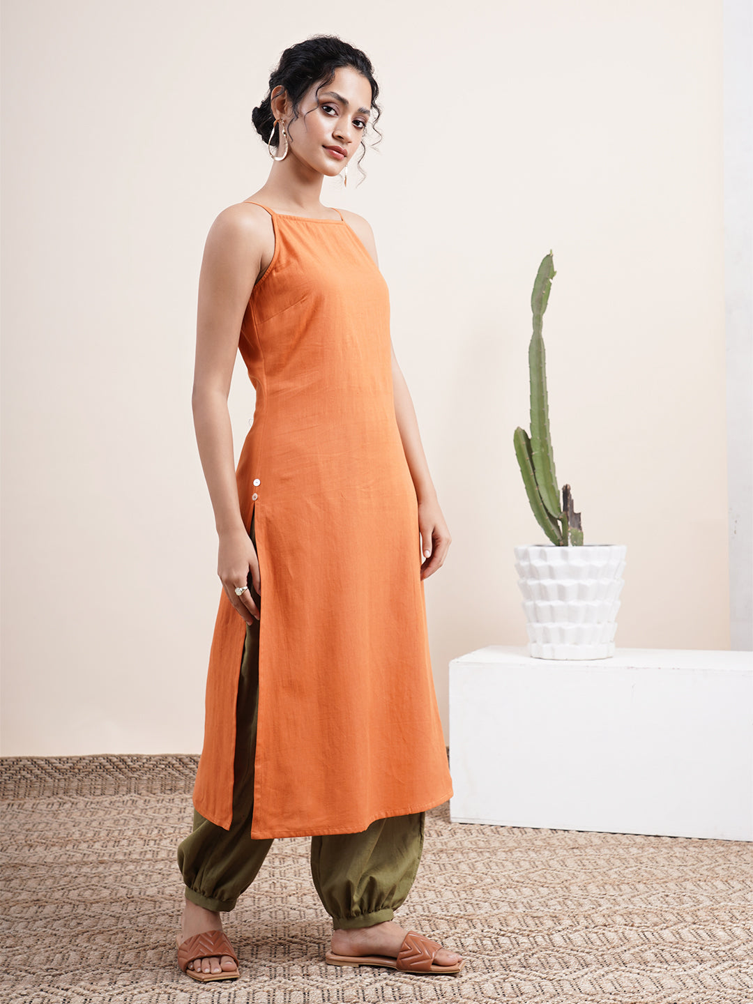 Rust Orange Spaghetti-sleeved kurta paired with pathani pants