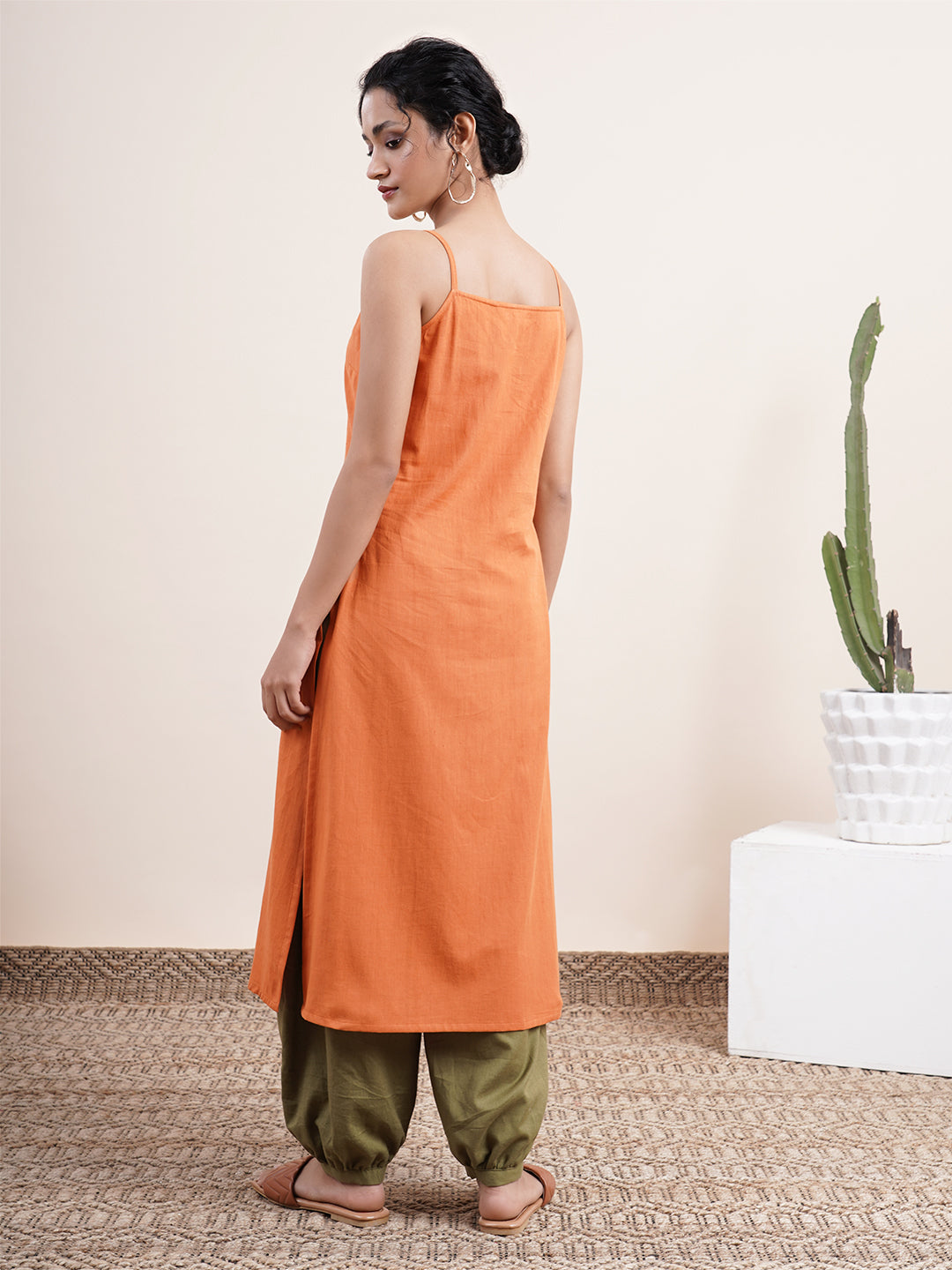 Rust Orange Spaghetti-sleeved kurta paired with pathani pants