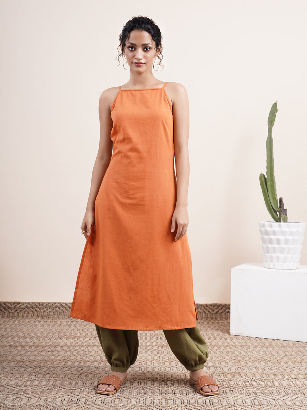 Rust Orange Spaghetti-sleeved kurta paired with pathani pants