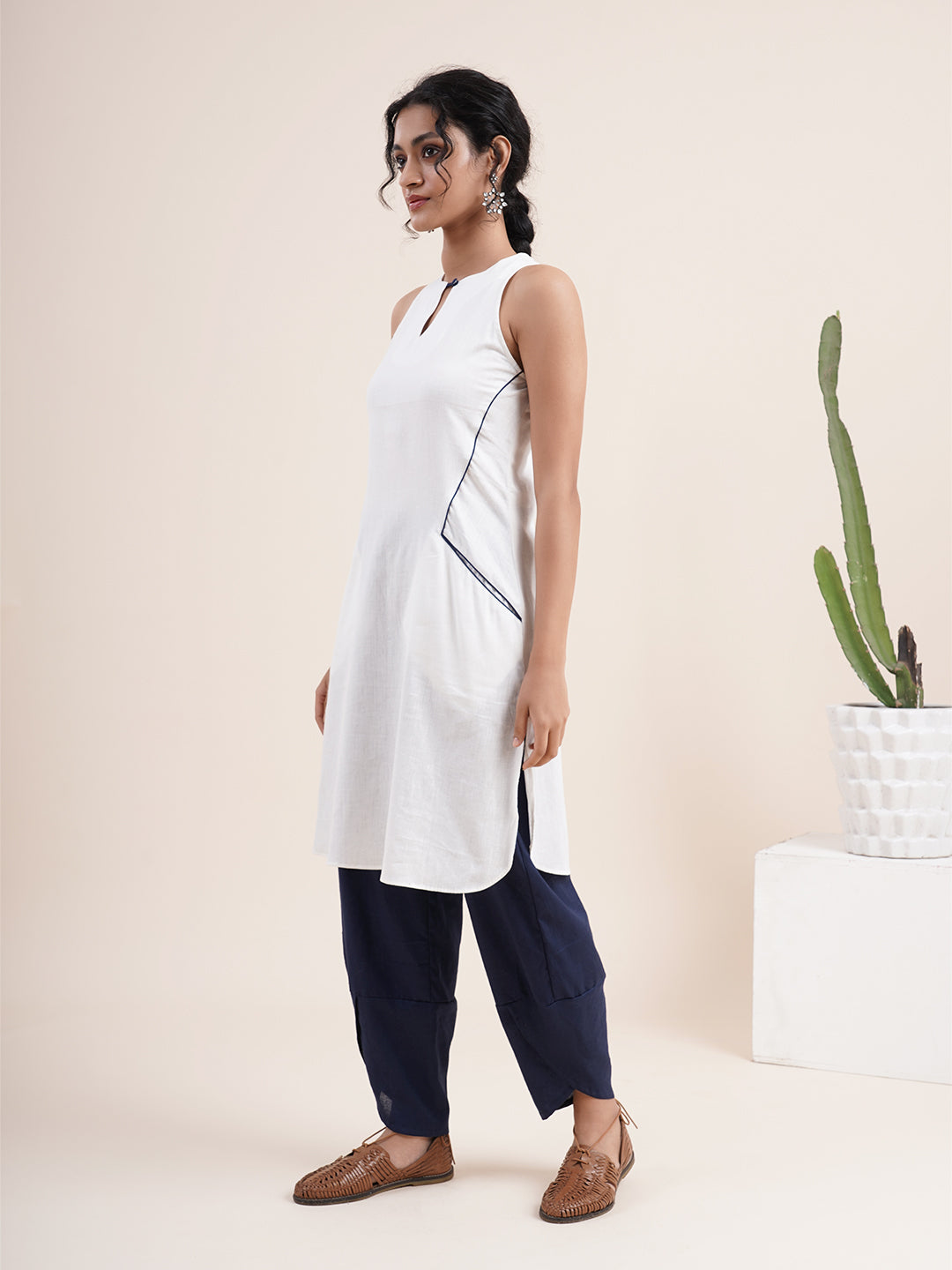 White keyhole kurta, paired with overlapped hem pants