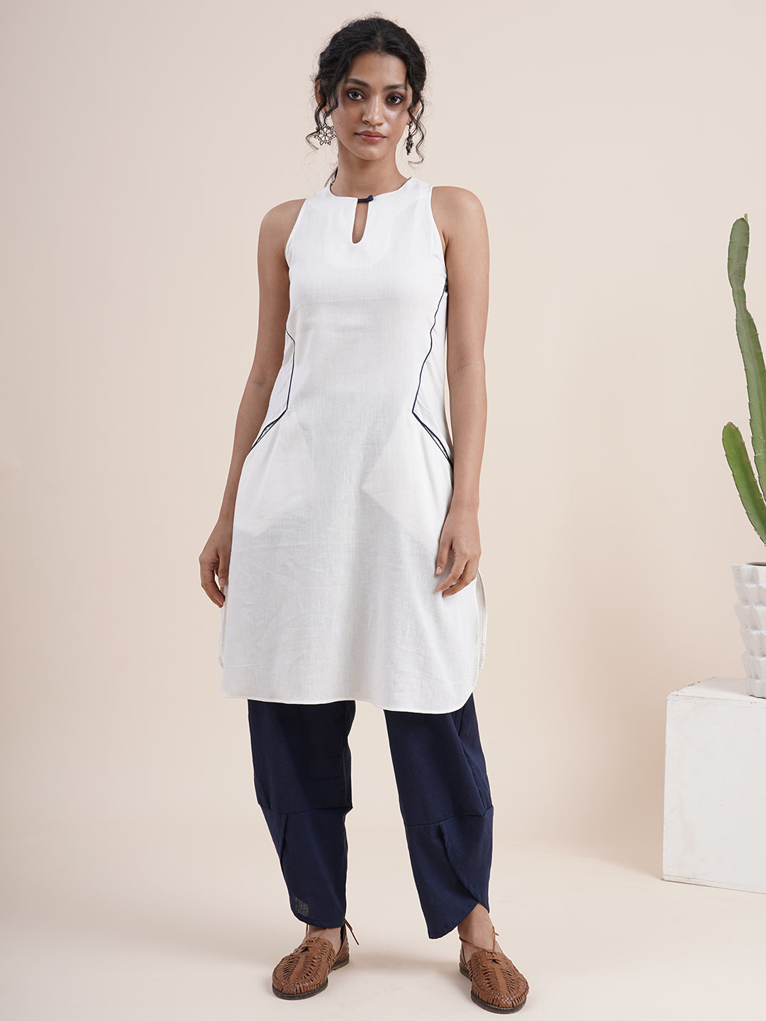 White keyhole kurta, paired with overlapped hem pants