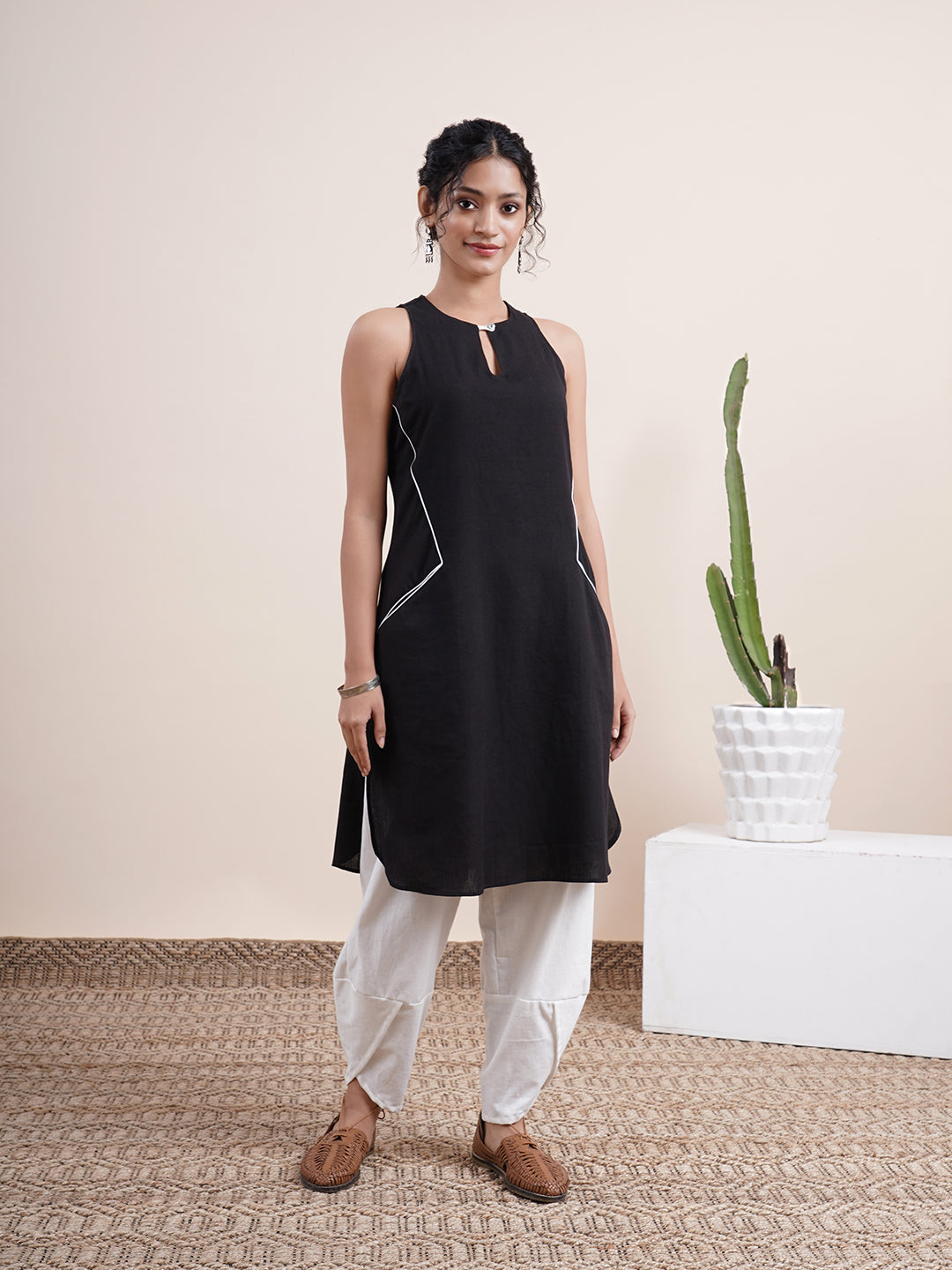 Black keyhole kurta, paired with overlapped hem pants