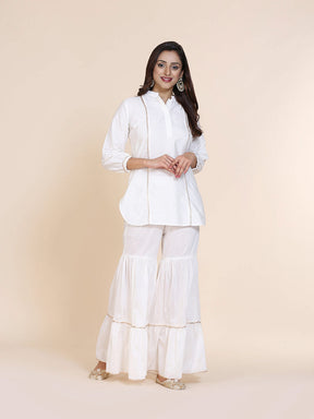 Abhishti cotton silk short kurti with hidden placket, side lace panels & pintucks and bottom