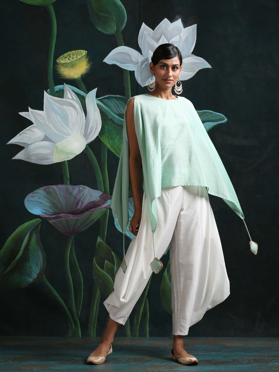 Cotton silk handkerchief hemline top detailed with attached tassels, along with flared dhoti pants Green
