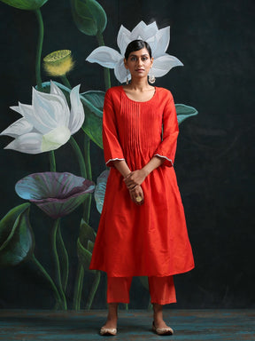 Cotton silk pleated flared kurta with detailed sleeves and pockets, along with straight bottoms Red