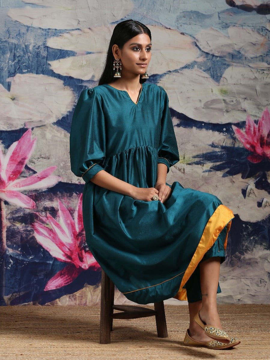 Cotton silk gathered kurta with U-hemline and contrast piping & facing, along with pleated pants Green
