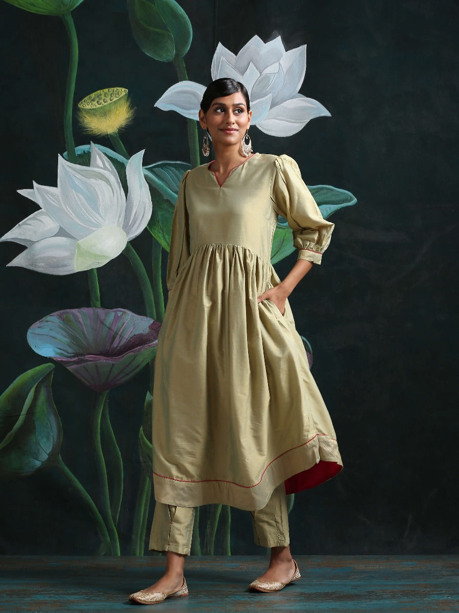 Cotton silk gathered kurta with U-hemline and contrast piping & facing, along with pleated pants Sage Green