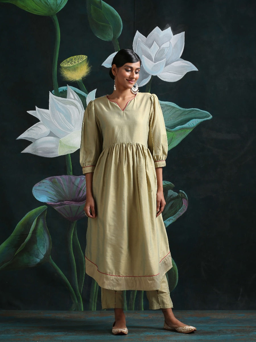 Cotton silk gathered kurta with U-hemline and contrast piping & facing, along with pleated pants Sage Green